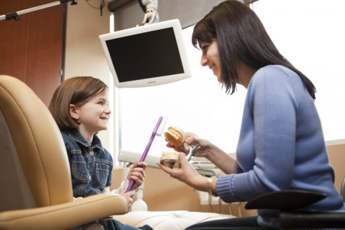 Dr. Brown with pediatric dental patient